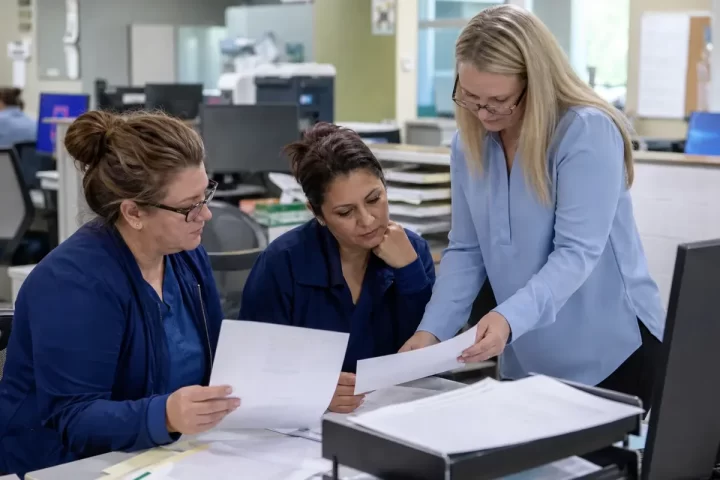 Multi-specialty practice leaders comparing medical billing proposals