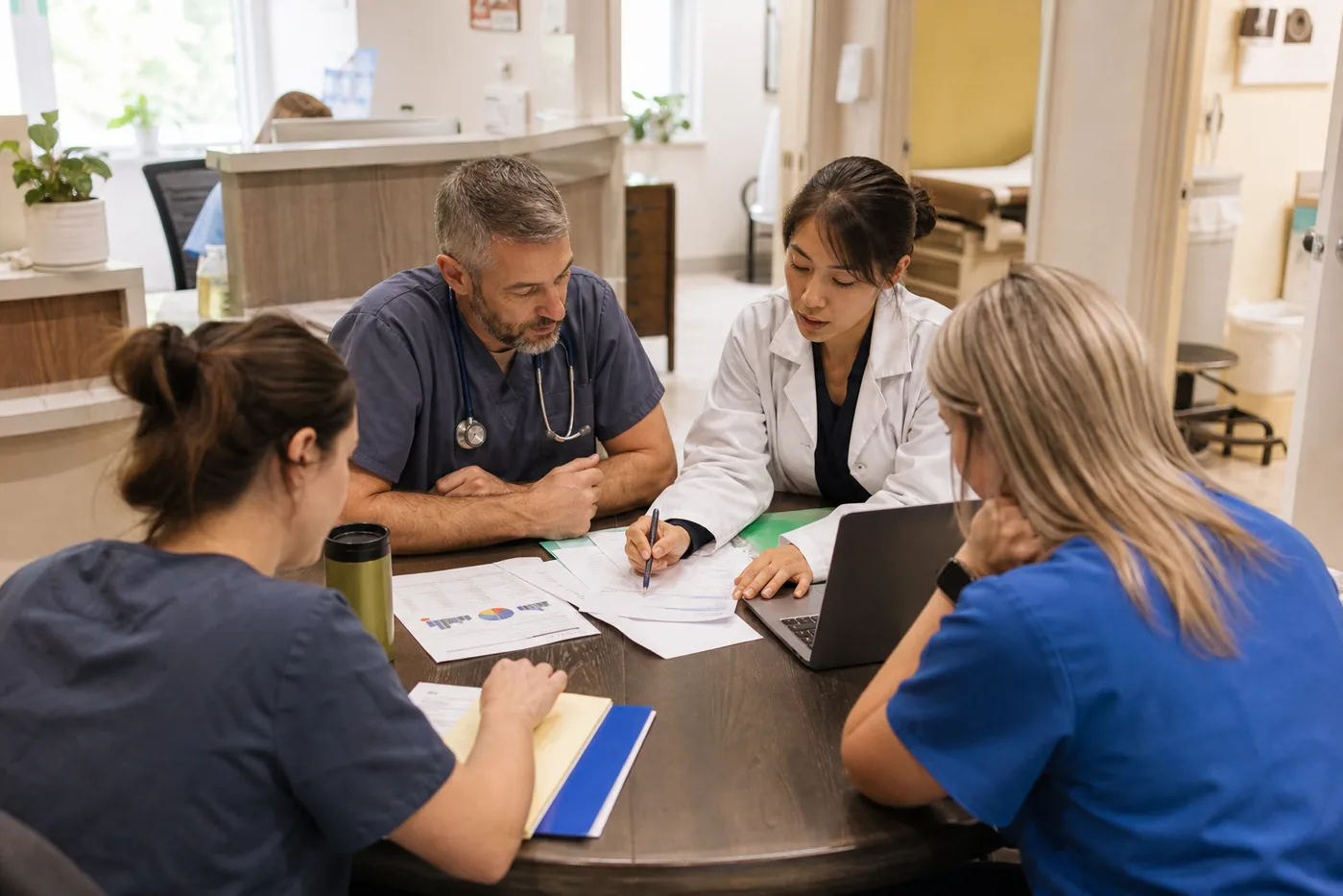 Small medical practice team reviewing revenue-cycle performance