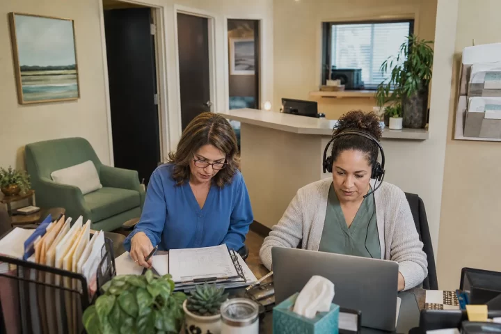 Behavioral health billing staff reviewing authorization and telehealth workflows